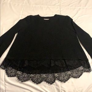 Juniors black knit sweater with lace detail